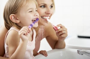 positive body image - mother and daughter brushing teeth together